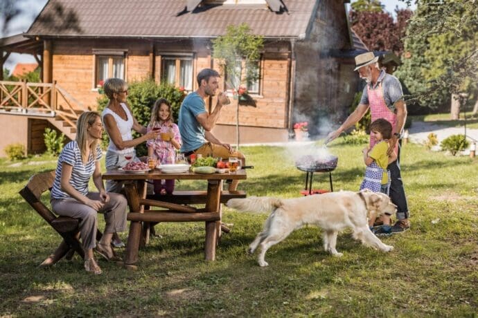 Family enjoying backyard barbecue without mosquitoes