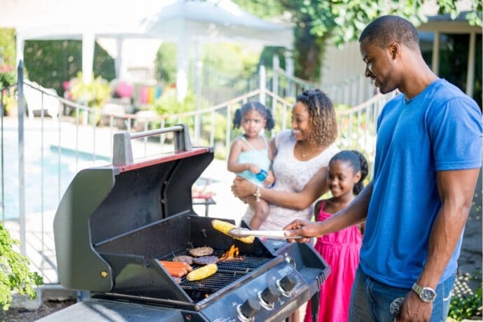 family enjoying summer barbecue
